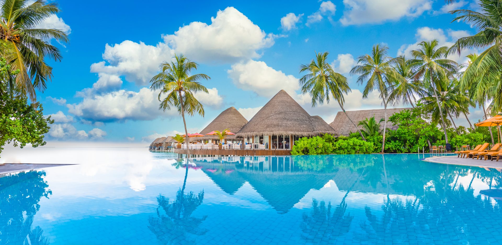 A luxury resort infinity pool at dusk